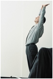 Man Stretching at the Office